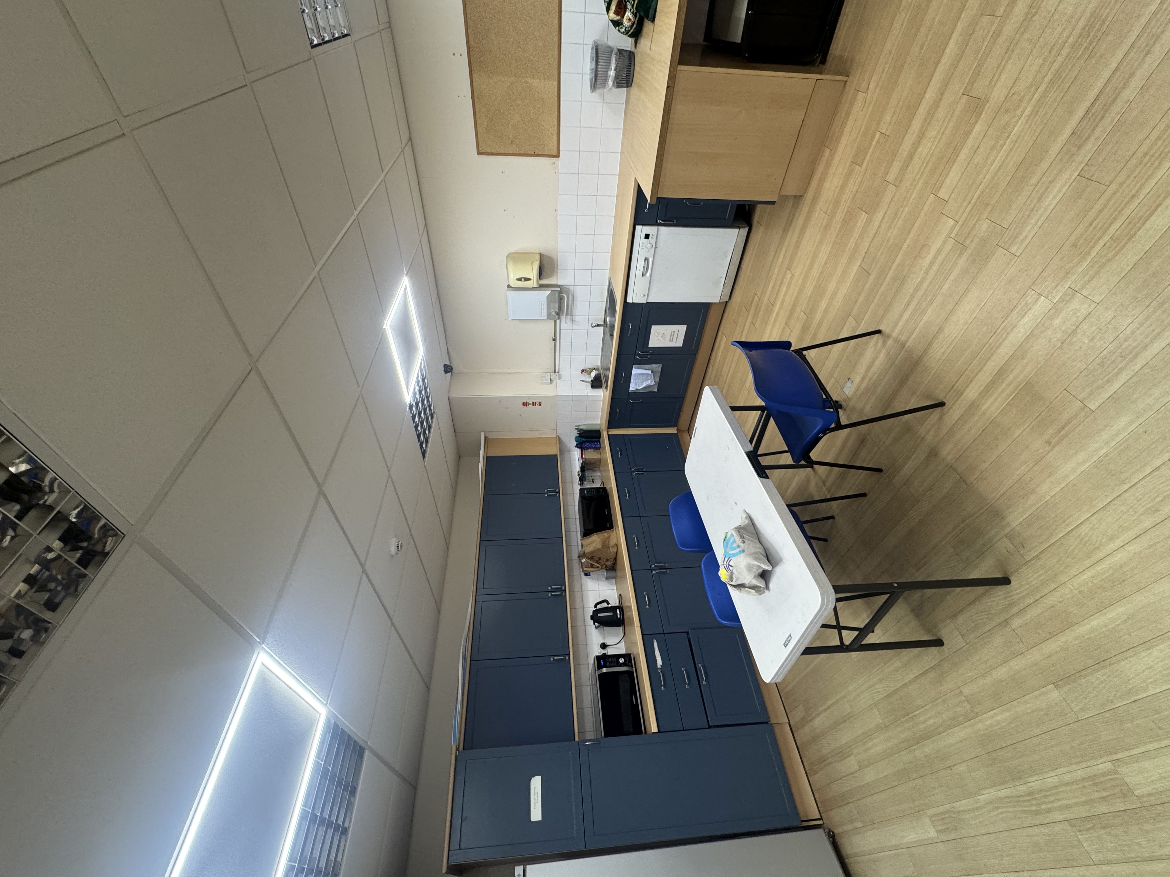 Modern kitchen facilities with refrigeration and food preparation areas